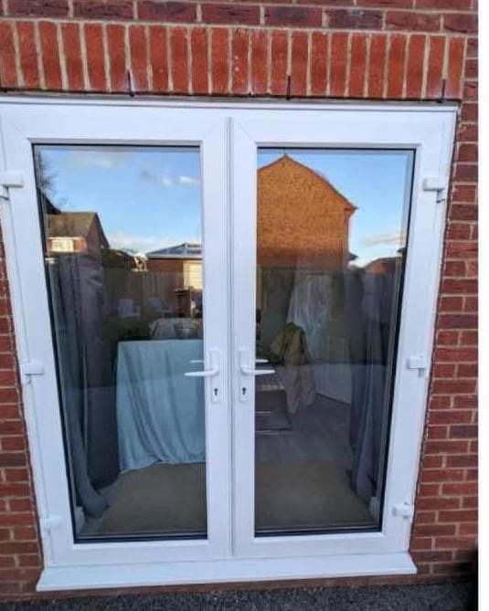 The French doors before spraying, in the original white UPVC